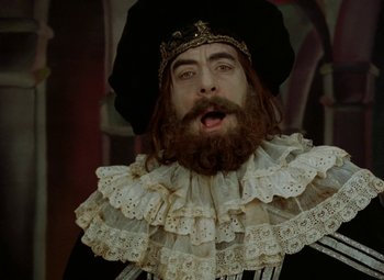 Movie still from “Faust” (1994), directed by Jan Svankmajer – A man with a beard wearing a lace collar; Close Up shot, Low angle