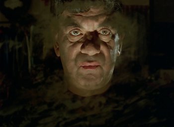 Movie still from “Faust” (1994), directed by Jan Svankmajer – A person's face with smoke coming out; Close Up shot, Low angle