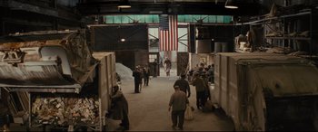 Movie still from “Fences” (2016), directed by Denzel Washington – A group of people standing in an industrial building; Extreme Wide shot, High angle
