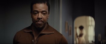 Movie still from “Fences” (2016), directed by Denzel Washington – A person wearing a brown shirt; Close Up shot, Over the shoulder angle