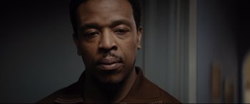 Movie still from “Fences” (2016), directed by Denzel Washington – A person wearing a brown jacket; Close Up shot, Low angle