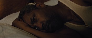 Movie still from “Fences” (2016), directed by Denzel Washington – A person laying on a bed; Close Up shot, Overhead angle