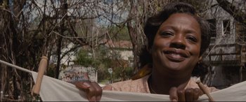 Movie still from “Fences” (2016), directed by Denzel Washington – A person holding a sheet of paper; Close Up shot, Low angle