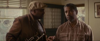 Movie still from “Fences” (2016), directed by Denzel Washington – Two men standing next to each other in a room; Close Up shot, Low angle