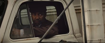 Movie still from “Fences” (2016), directed by Denzel Washington – A person sitting in a truck window; Close Up shot, Low angle
