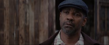 Movie still from “Fences” (2016), directed by Denzel Washington – A person wearing a hat; Close Up shot, Low angle