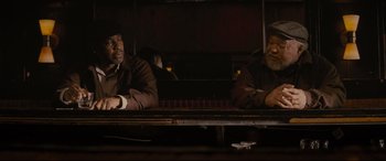 Movie still from “Fences” (2016), directed by Denzel Washington – Two men sitting next to each other on a bench; Medium shot, High angle