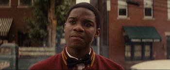 Movie still from “Fences” (2016), directed by Denzel Washington – A man in a red jacket and a bow tie; Close Up shot, Over the shoulder angle