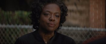 Movie still from “Fences” (2016), directed by Denzel Washington – An older black woman wearing a black shirt; Close Up shot, Over the shoulder angle