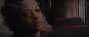 Movie still from “Fences” (2016), directed by Denzel Washington – A person looking at the camera; Close Up shot, Over the shoulder angle