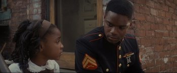 Movie still from “Fences” (2016), directed by Denzel Washington – A man in a uniform talking to a young boy; Close Up shot, Over the shoulder angle