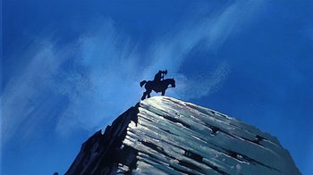 Movie still from “Fire and Ice” (1983), directed by Ralph Bakshi – A man riding a horse on top of a wooden structure; Wide shot, Low angle