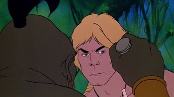 Movie still from “Fire and Ice” (1983), directed by Ralph Bakshi – A cartoon of a man with long blonde hair; Close Up shot, Over the shoulder angle