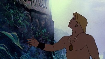 Movie still from “Fire and Ice” (1983), directed by Ralph Bakshi – A man is standing in front of a cliff; Medium shot, Low angle