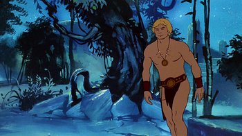 Movie still from “Fire and Ice” (1983), directed by Ralph Bakshi – A man standing in front of a tree in the woods; Wide shot, Low angle