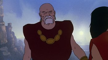 Movie still from “Fire and Ice” (1983), directed by Ralph Bakshi – An animated picture of an old man with a beard; Medium shot, Low angle