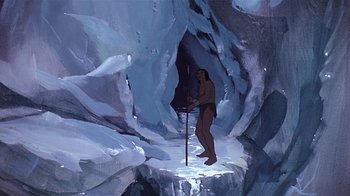 Movie still from “Fire and Ice” (1983), directed by Ralph Bakshi – A painting of a man standing in a cave; Wide shot, High angle