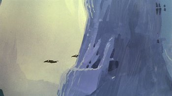 Movie still from “Fire and Ice” (1983), directed by Ralph Bakshi – Two birds flying in front of a large waterfall; Extreme Wide shot, Low angle