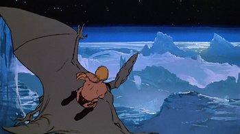 Movie still from “Fire and Ice” (1983), directed by Ralph Bakshi – A scene from the flintstones , featuring a man on a cliff; Extreme Wide shot, Overhead angle