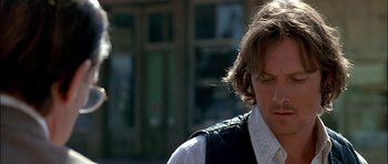 Movie still from “Fire in the Sky” (1993), directed by Robert Lieberman – A person with long hair; Close Up shot, Low angle