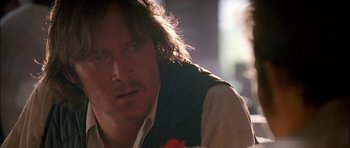 Movie still from “Fire in the Sky” (1993), directed by Robert Lieberman – A person with long hair; Close Up shot, Over the shoulder angle