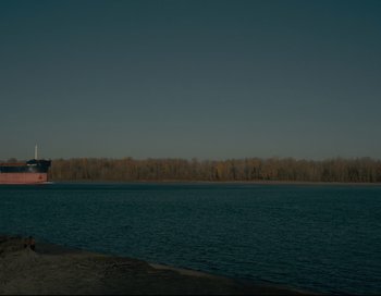 Movie still from “First Cow” (2019), directed by Kelly Reichardt – A large body of water near a body of water; Extreme Wide shot, Low angle