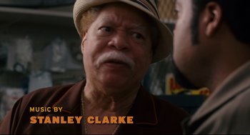 Movie still from “First Sunday” (2008), directed by David E. Talbert – An older man wearing a hat and a brown jacket; Close Up shot, Over the shoulder angle