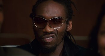 Movie still from “First Sunday” (2008), directed by David E. Talbert – A person wearing sunglasses; Close Up shot, Low angle