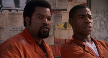 Movie still from “First Sunday” (2008), directed by David E. Talbert – Two men in orange shirts are standing next to each other; Close Up shot, Low angle