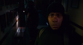 Movie still from “First Sunday” (2008), directed by David E. Talbert – A man in a black jacket and a black hat; Close Up shot, Low angle