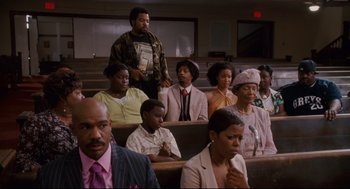 Movie still from “First Sunday” (2008), directed by David E. Talbert – A group of people sitting in a lecture hall; Medium shot, High angle
