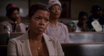 Movie still from “First Sunday” (2008), directed by David E. Talbert – Two women sitting in front of each other in a room; Close Up shot, Over the shoulder angle