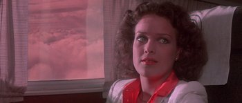 Movie still from “Flash Gordon” (1980), directed by Mike Hodges – A person wearing a white shirt; Close Up shot, Low angle