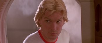Movie still from “Flash Gordon” (1980), directed by Mike Hodges – A person with blonde hair; Close Up shot, Low angle