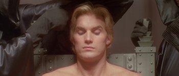 Movie still from “Flash Gordon” (1980), directed by Mike Hodges – A person with his eyes closed; Close Up shot, High angle