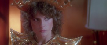 Movie still from “Flash Gordon” (1980), directed by Mike Hodges – A person wearing a costume; Close Up shot, Over the shoulder angle
