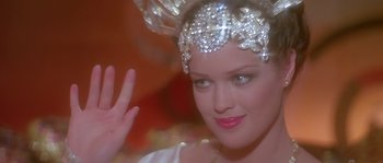 Movie still from “Flash Gordon” (1980), directed by Mike Hodges – A person wearing a tiara; Close Up shot, Over the shoulder angle