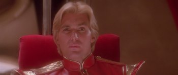 Movie still from “Flash Gordon” (1980), directed by Mike Hodges – A person wearing a red uniform; Close Up shot, Low angle