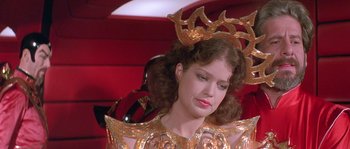 Movie still from “Flash Gordon” (1980), directed by Mike Hodges – A person wearing a costume; Close Up shot, Over the shoulder angle