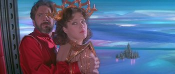Movie still from “Flash Gordon” (1980), directed by Mike Hodges – A woman in a red dress and a gold crown; Medium shot, Low angle