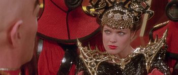 Movie still from “Flash Gordon” (1980), directed by Mike Hodges – A person wearing a costume; Close Up shot, Over the shoulder angle