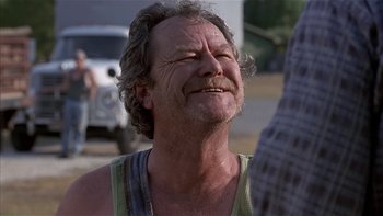 Movie still from “Flesh and Bone” (1993), directed by Steve Kloves – An older man with a beard is looking up; Close Up shot, Over the shoulder angle
