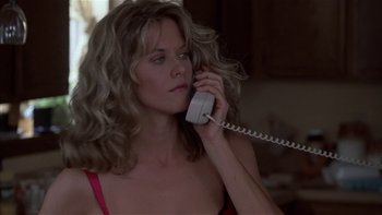 Movie still from “Flesh and Bone” (1993), directed by Steve Kloves – A woman talking on a phone while wearing a red bra; Close Up shot, Low angle