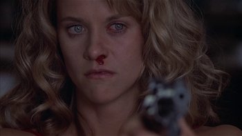 Movie still from “Flesh and Bone” (1993), directed by Steve Kloves – A person holding a gun; Close Up shot, Over the shoulder angle