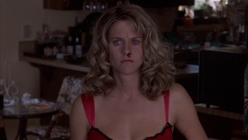 Movie still from “Flesh and Bone” (1993), directed by Steve Kloves – A person wearing a red dress; Close Up shot, Low angle