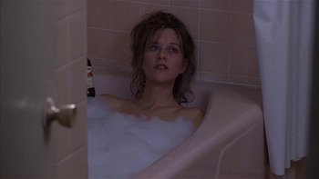 Movie still from “Flesh and Bone” (1993), directed by Steve Kloves – A woman sitting in a bath tub in a bathroom; Close Up shot, High angle