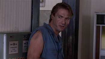 Movie still from “Flesh and Bone” (1993), directed by Steve Kloves – A person wearing a blue shirt; Close Up shot, Low angle
