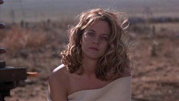 Movie still from “Flesh and Bone” (1993), directed by Steve Kloves – A woman with a towel draped around her shoulders; Close Up shot, Low angle
