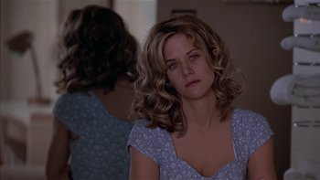 Movie still from “Flesh and Bone” (1993), directed by Steve Kloves – A woman in a blue dress looking at a mirror; Close Up shot, Over the shoulder angle