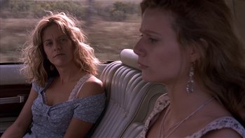 Movie still from “Flesh and Bone” (1993), directed by Steve Kloves – Two women sitting in a car on the side of the road; Close Up shot, Low angle
